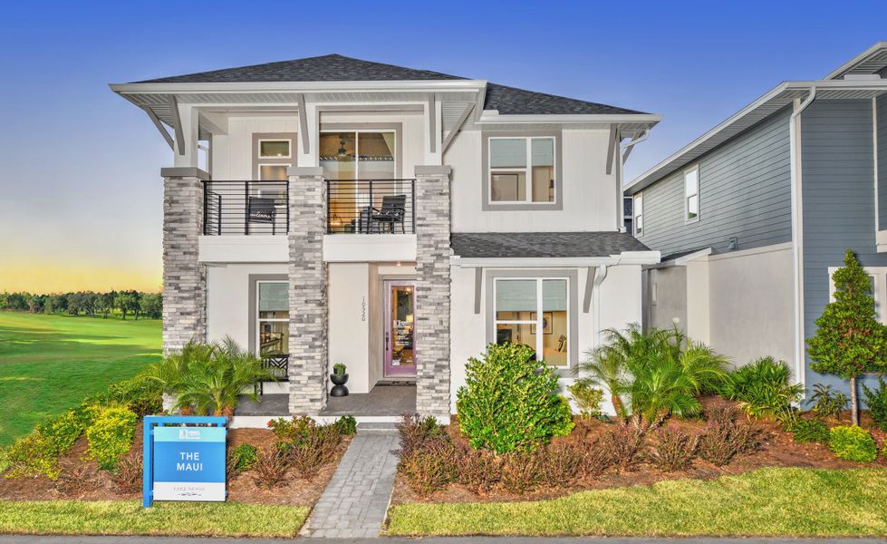 Front exterior of a new home in Laureate Park, Orlando, FL, highlighting curb appeal (Image 1). Front exterior of a new home in Laureate Park, Orlando, FL, highlighting curb appeal (Image 1).