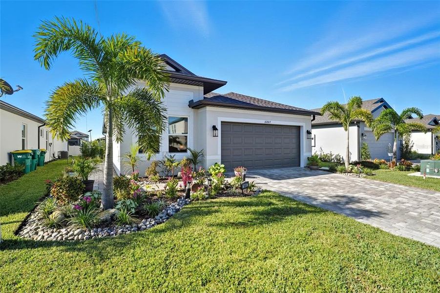 Front exterior of a new home in , Port Charlotte, FL, highlighting curb appeal (Image 23). Front exterior of a new home in , Port Charlotte, FL, highlighting curb appeal (Image 23).