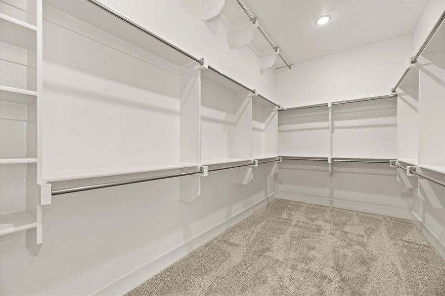 You'll find seasonal hanging racks and plenty of space in this dream closet!