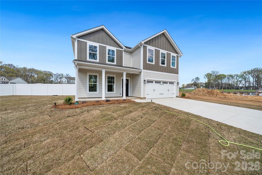 Front exterior of a new home in , Stanfield, NC, highlighting curb appeal (Image 16).