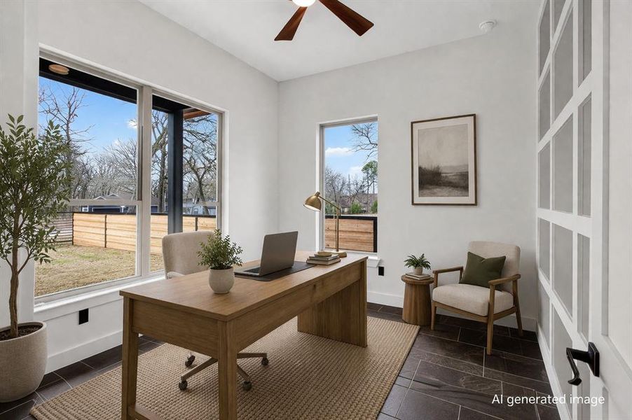 Office with a ceiling fan and baseboards