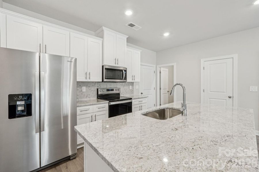 Photo is not of the actual home, but is an inspirational photo of builder’s model home and may depict options, furnishings, and/or decorator features that are not included