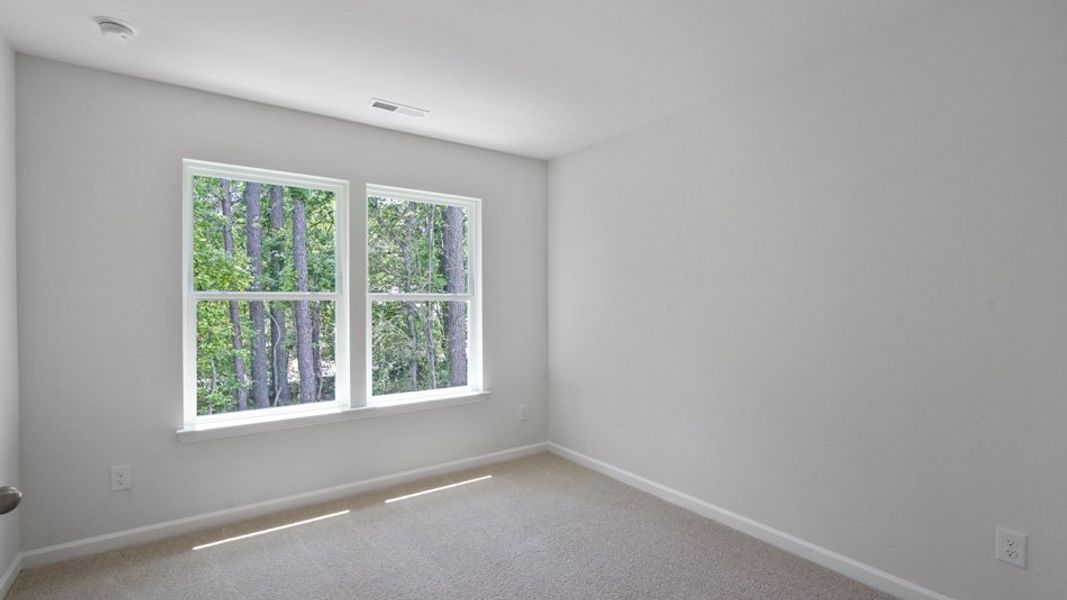 Spacious, unfurnished interior of a new home in Copper Run South, Durham (Image 24).