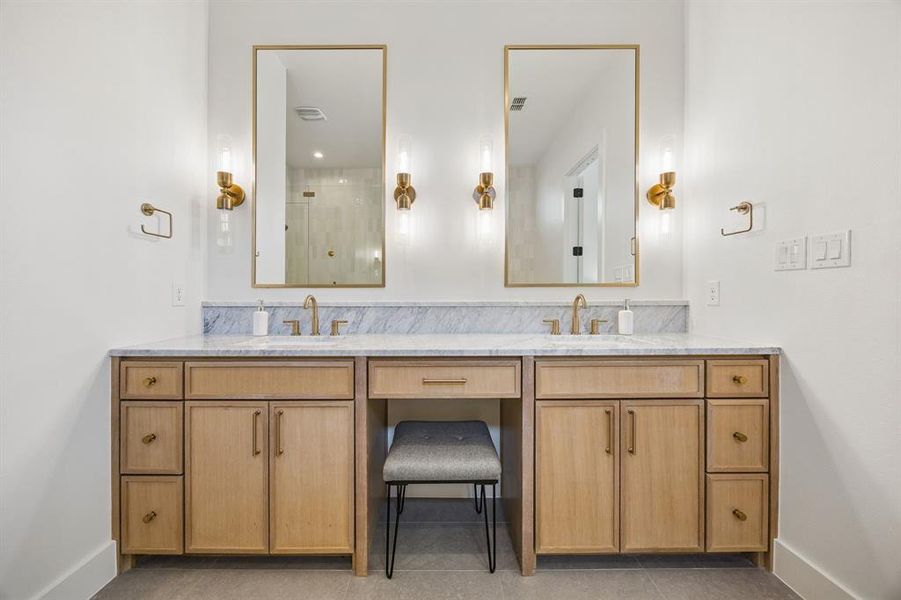 Double vanity includes seated vanity, storage and 2 sinks.