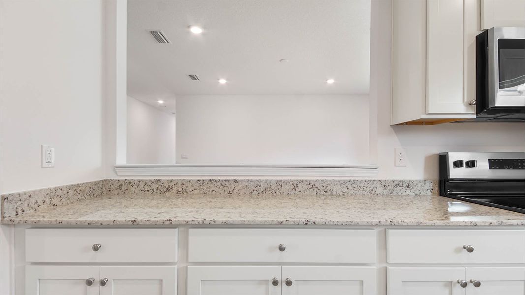 Representative furnished interior of a home built from the Aspen by D.R. Horton in Owl's Head East, Freeport (Image 10).