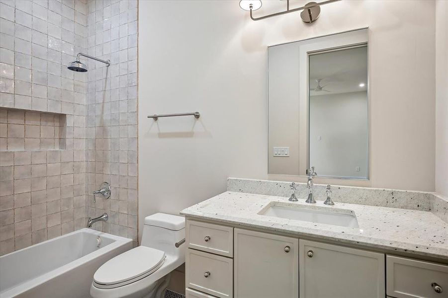 Bath, tub/shower combo, white glazed tile surround, stone countertop, single vanity Bath, tub/shower combo, white glazed tile surround, stone countertop, single vanity