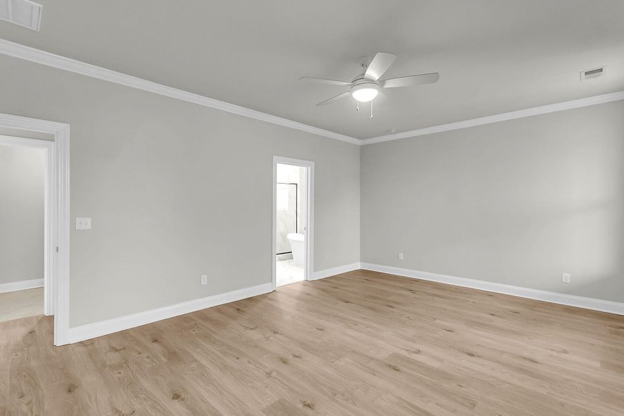 Spacious, unfurnished interior of a new home in Tidewater at Lakes of Cane Bay, Summerville (Image 27).