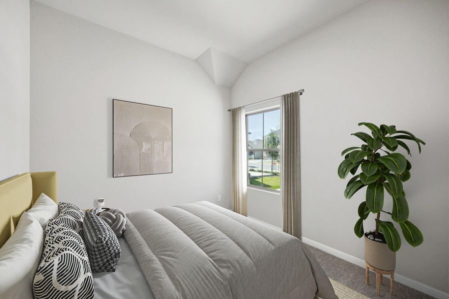 Bedroom featuring carpet and baseboards