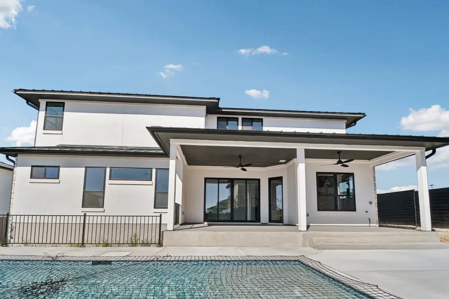 Exterior details and patio area of a home in Milky Way at River Place, Austin (Image 3).