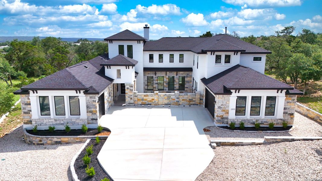 Front exterior of a new home in , New Braunfels, TX, highlighting curb appeal (Image 30).
