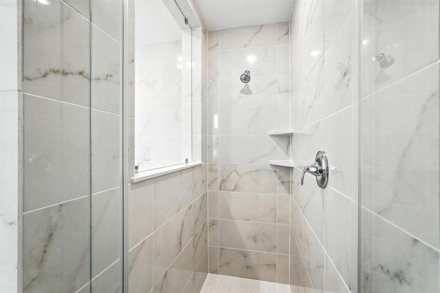 Bathroom featuring a shower stall Bathroom featuring a shower stall