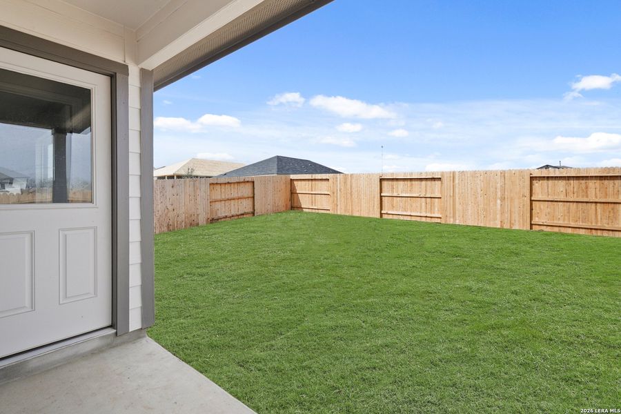 Exterior details and patio area of a home in Hickory Ridge, Elmendorf (Image 3).