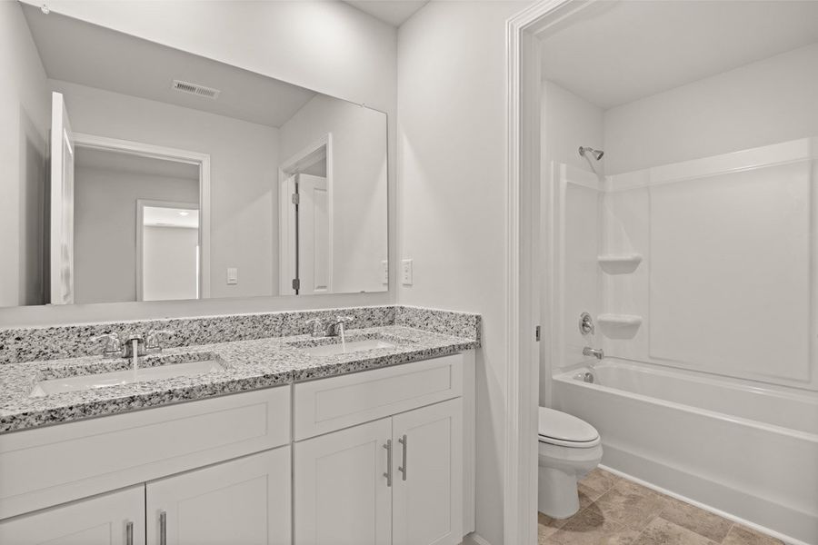 Representative furnished interior of a home built from the Mansfield by D.R. Horton in Southwind Village, Evans (Image 15).