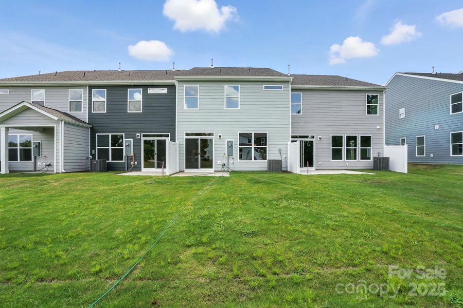 Front exterior of a new home in Harrisburg Village Townhomes, Harrisburg, NC, highlighting curb appeal (Image 17).