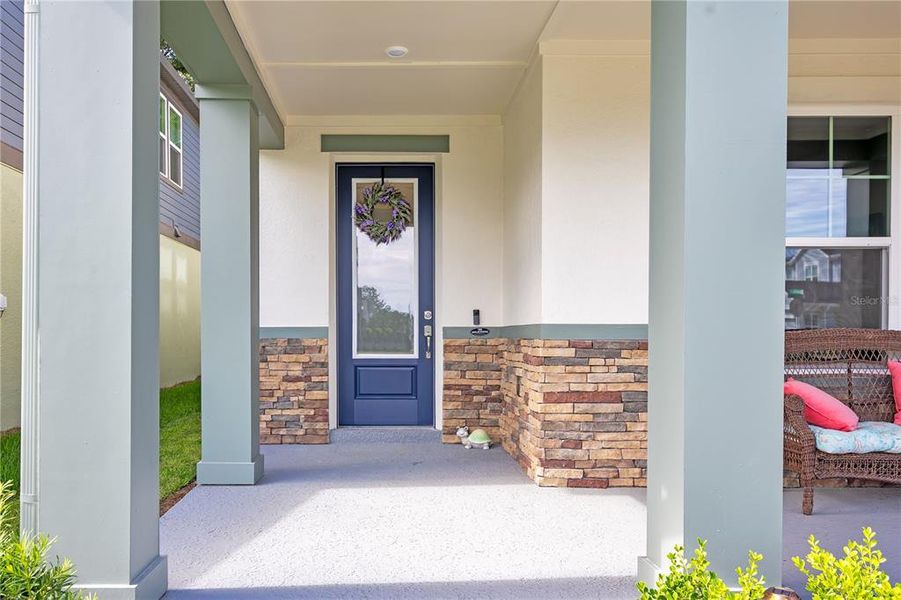 Exterior details and patio area of a home in Oakfield at Mount Dora Village Series, Mount Dora (Image 28).