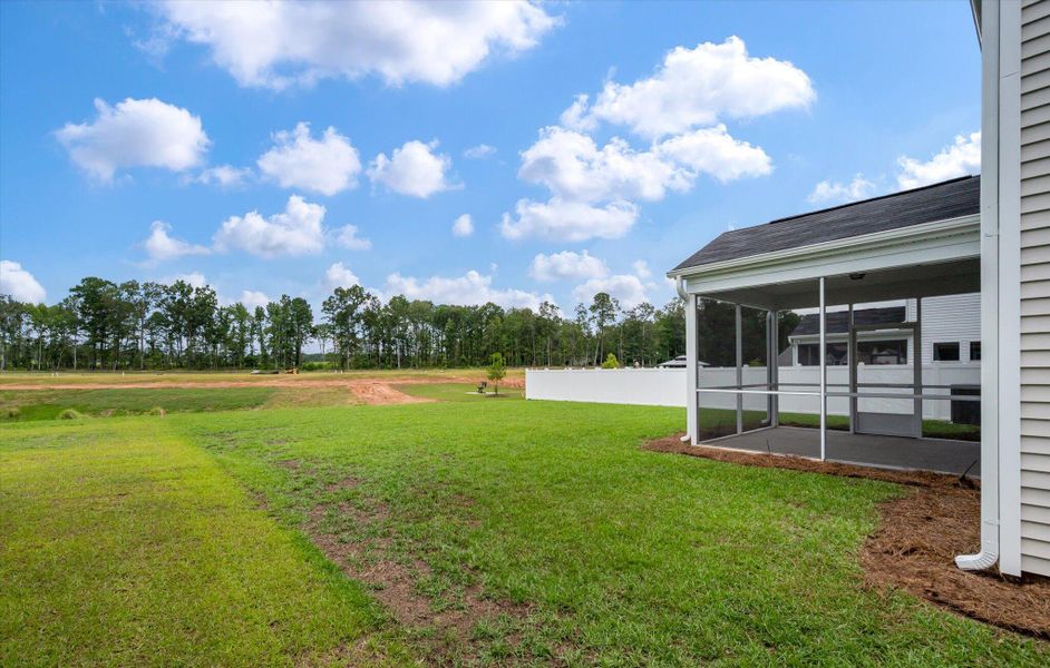 Front exterior of a new home in Parker's Preserve, Ridgeville, SC, highlighting curb appeal (Image 1). Front exterior of a new home in Parker's Preserve, Ridgeville, SC, highlighting curb appeal (Image 1).