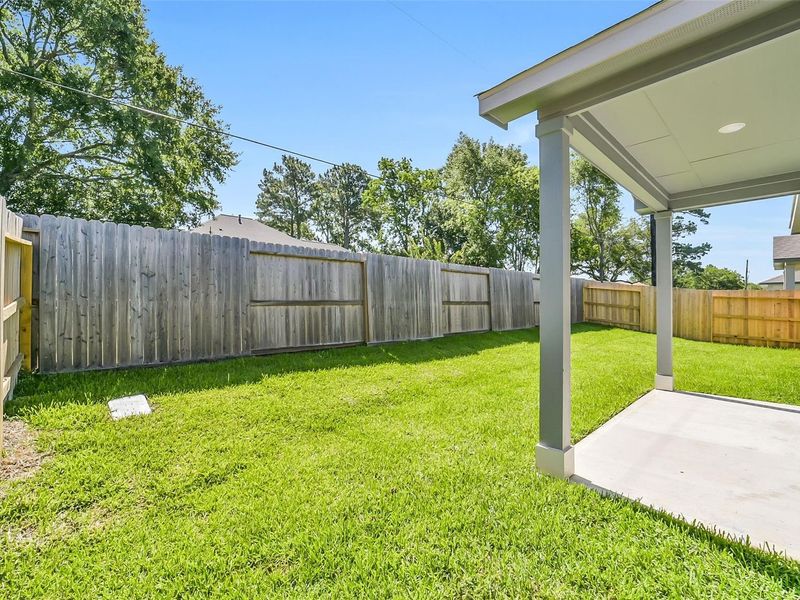 Exterior details and patio area of a home in Windmill Estates, Magnolia (Image 23). Exterior details and patio area of a home in Windmill Estates, Magnolia (Image 23).