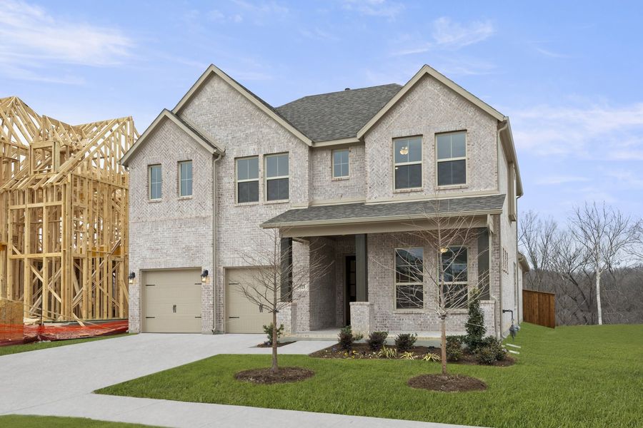 Front exterior of a new home in Providence Cove, McKinney, TX, highlighting curb appeal (Image 2). Front exterior of a new home in Providence Cove, McKinney, TX, highlighting curb appeal (Image 2).