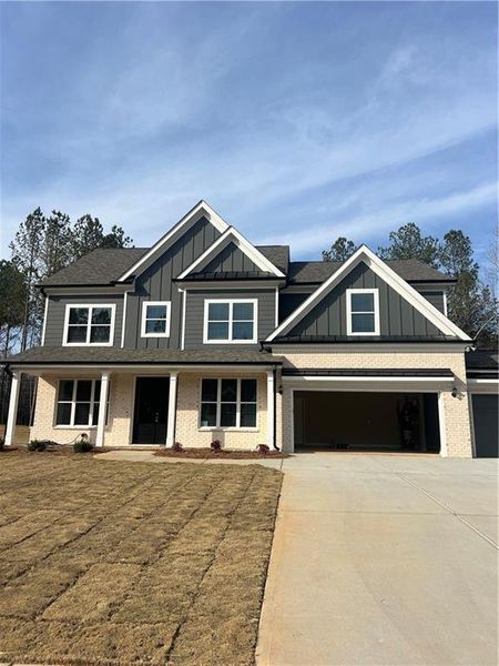 Front exterior of a new home in , Loganville, GA, highlighting curb appeal (Image 24).