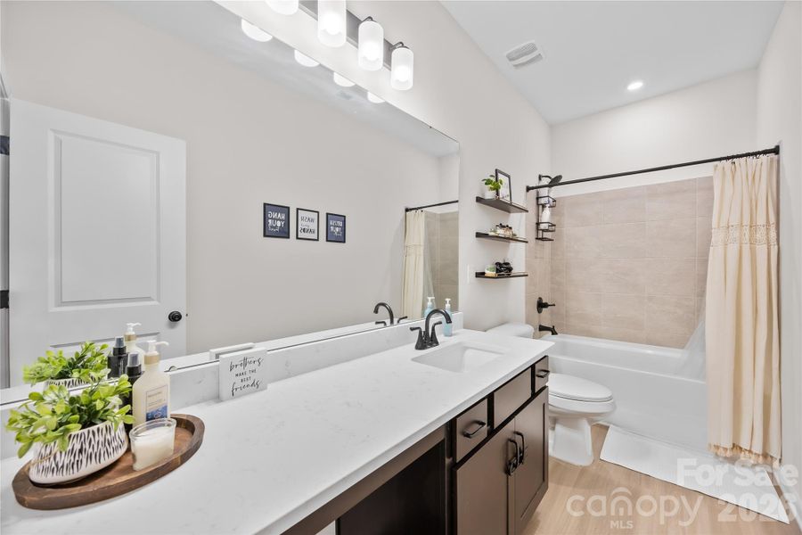 Furnished interior view inside a new home in Orchard Creek, Charlotte (Image 34).