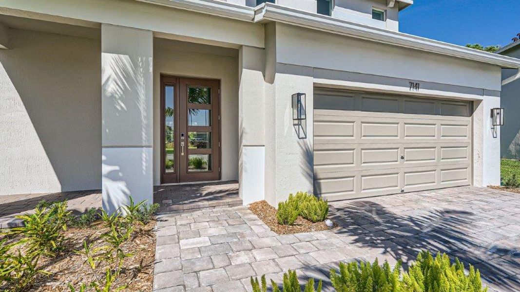 Representative exterior photo of a completed home built from the Ponte Vedra by D.R. Horton in Preserves at Park Trace, Stuart, FL (Image 17).