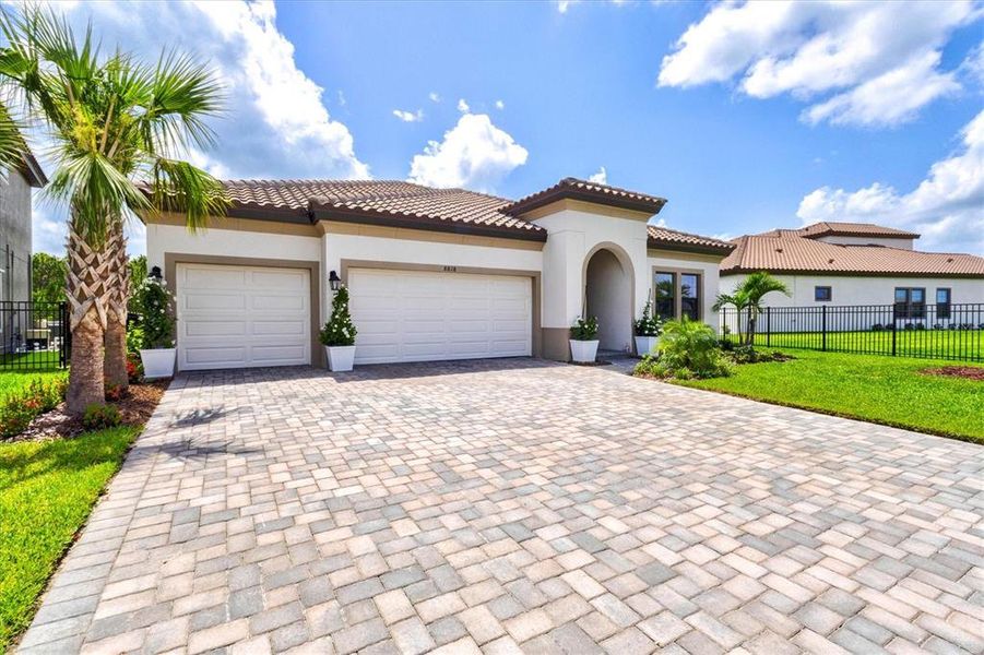Front exterior of a new home in Crosswind Ranch, Parrish, FL, highlighting curb appeal (Image 34).