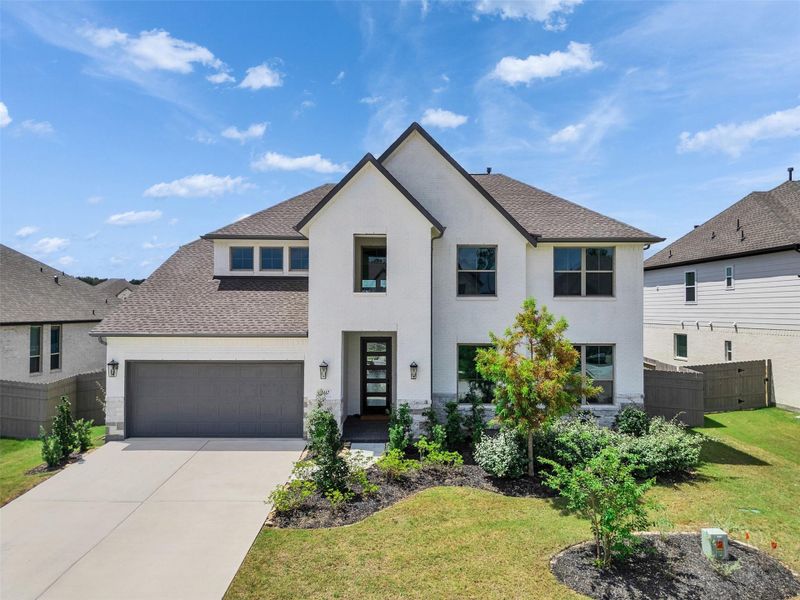 Front exterior of a new home in ARTAVIA®, Conroe, TX, highlighting curb appeal (Image 1). Front exterior of a new home in ARTAVIA®, Conroe, TX, highlighting curb appeal (Image 1).