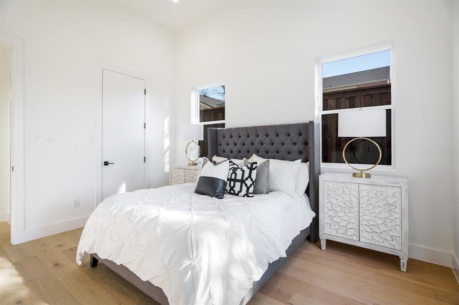 Bedroom with light hardwood / wood-style flooring