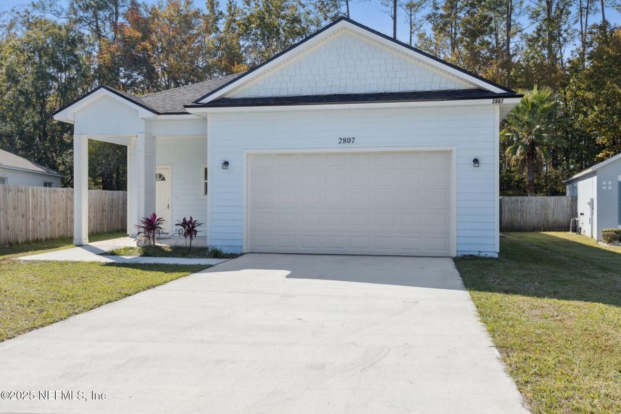 Front exterior of a new home in , Middleburg, FL, highlighting curb appeal (Image 22).