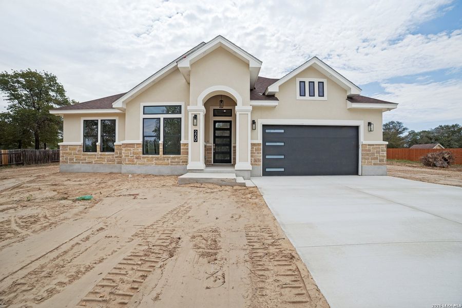 Front exterior of a new home in , Natalia, TX, highlighting curb appeal (Image 23).