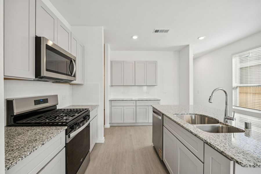 Furnished interior view inside a new home in Decker Farms, Magnolia (Image 9).