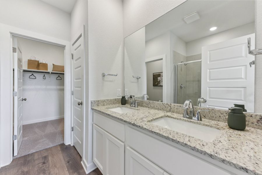 A bathroom with a marble countertop.