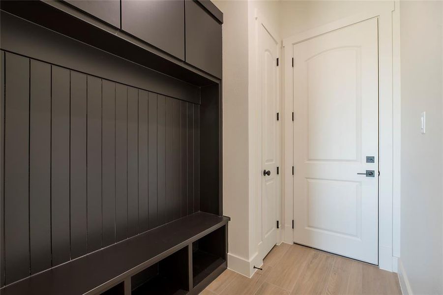 Mudroom featuring light wood-type flooring and baseboards Mudroom featuring light wood-type flooring and baseboards
