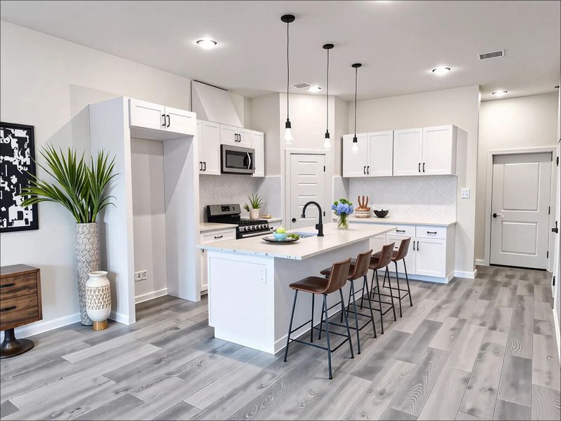 This spacious kitchen boasts a large island with seating, perfect for casual dining, morning coffee, or entertaining guests. *virtually staged & digitally enhanced This spacious kitchen boasts a large island with seating, perfect for casual dining, morning coffee, or entertaining guests. *virtually staged & digitally enhanced