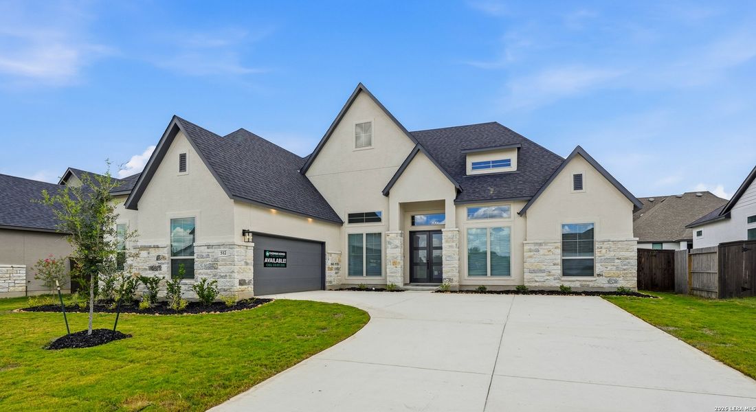 Front exterior of a new home in Mesa Western, Cibolo, TX, highlighting curb appeal (Image 1). Front exterior of a new home in Mesa Western, Cibolo, TX, highlighting curb appeal (Image 1).