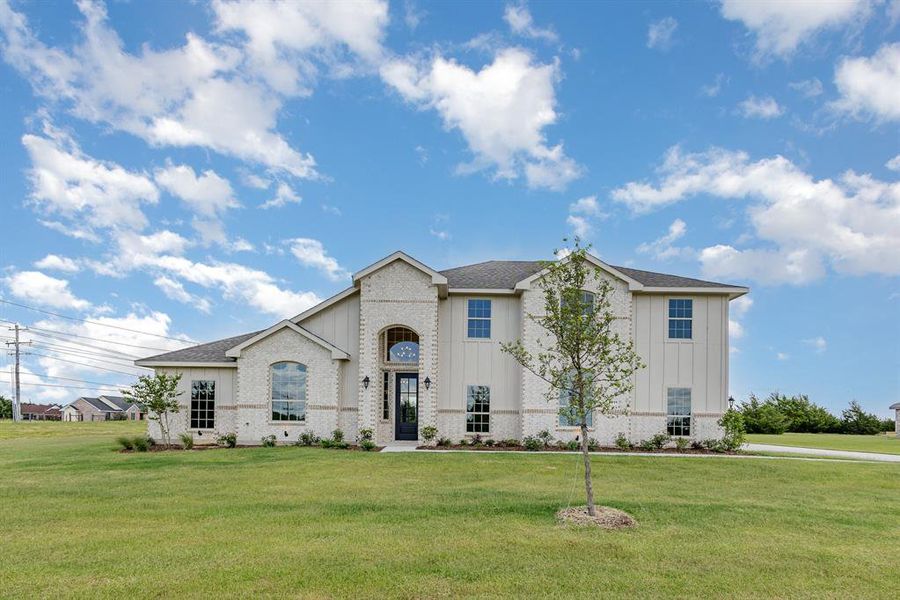 Front exterior of a new home in Sagebrush Addition, Midlothian, TX, highlighting curb appeal (Image 16).