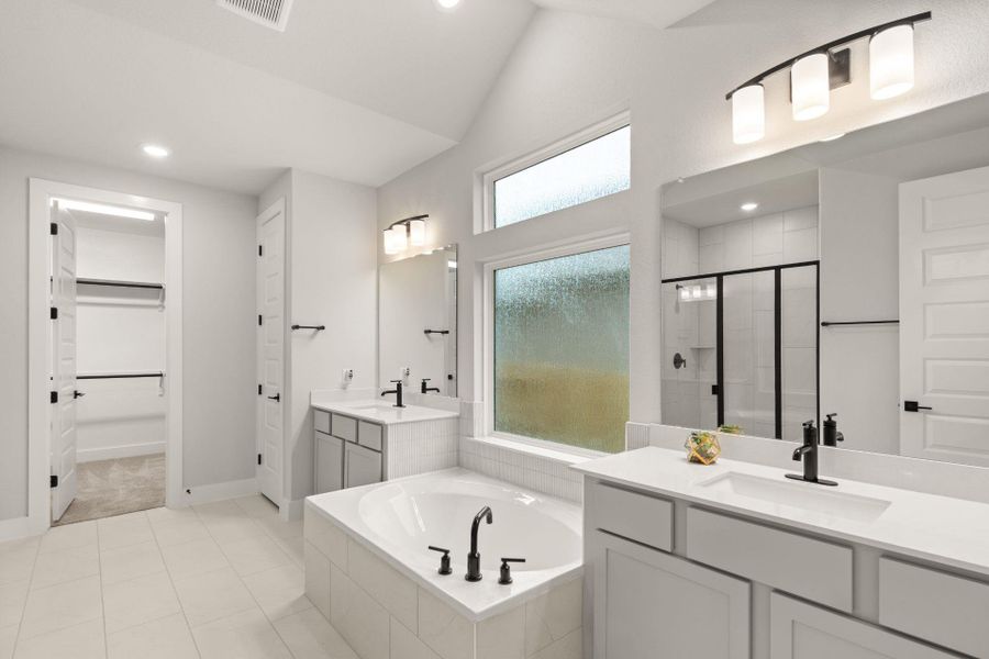 Primary Bath retreat with dual vanities & garden tub - Representative Photo