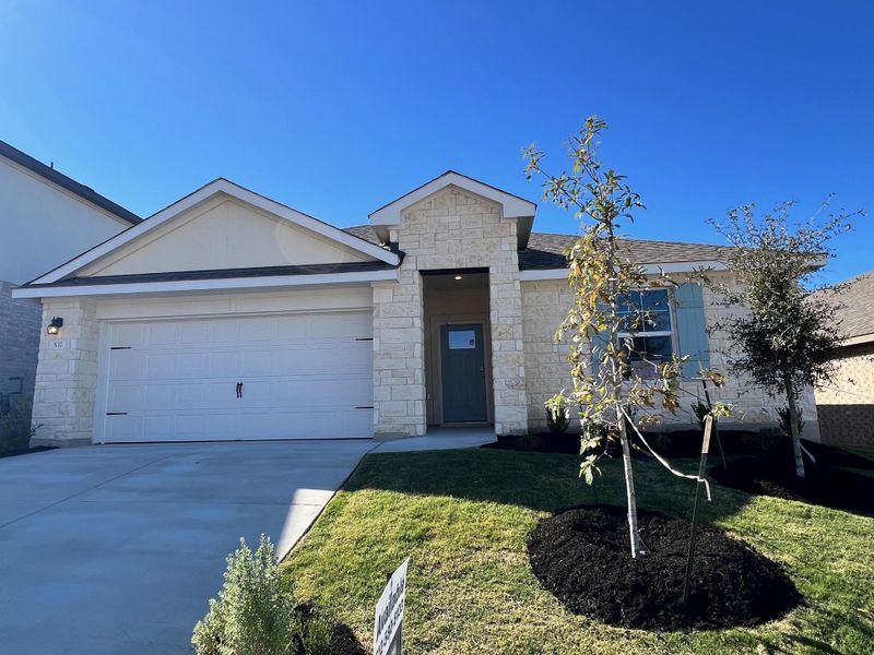 Front exterior of a new home in Rosenbusch Ranch, Leander, TX, highlighting curb appeal (Image 2). Front exterior of a new home in Rosenbusch Ranch, Leander, TX, highlighting curb appeal (Image 2).