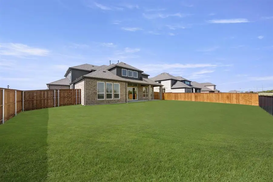 Front exterior of a new home in Polo Ridge, Mesquite, TX, highlighting curb appeal (Image 2). Front exterior of a new home in Polo Ridge, Mesquite, TX, highlighting curb appeal (Image 2).