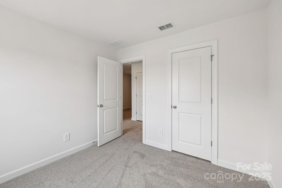 Spacious, unfurnished interior of a new home in Meadows at Wilson Farms - The Heights Series, Fort Mill (Image 22). Spacious, unfurnished interior of a new home in Meadows at Wilson Farms - The Heights Series, Fort Mill (Image 22).