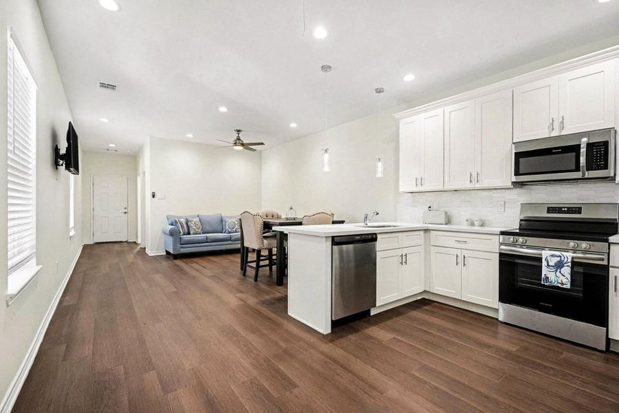 Open to dining and living area!! Beautiful flooring and lighting! Open to dining and living area!! Beautiful flooring and lighting!