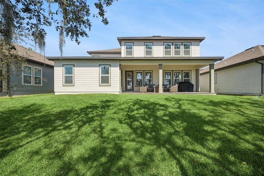 Exterior details and patio area of a home in Northlake at Ovation, Winter Garden (Image 4).