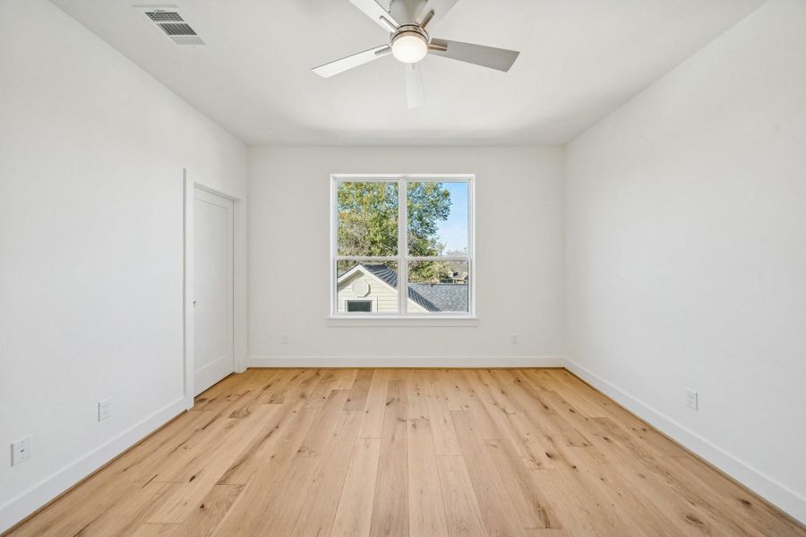 Upstairs secondary bedroom on the back side of the house. That door is to a huge closet. There is another door not shown to the walk-in attic. Upstairs secondary bedroom on the back side of the house. That door is to a huge closet. There is another door not shown to the walk-in attic.