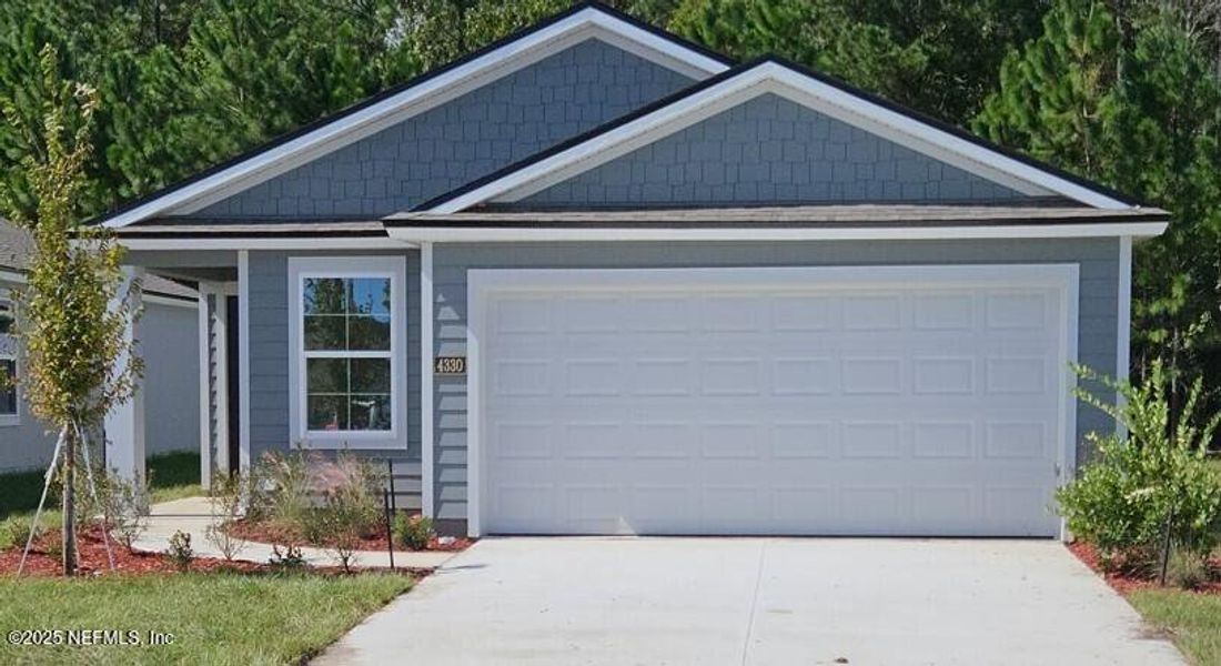 Front exterior of a new home in The Arbors, Jacksonville, FL, highlighting curb appeal (Image 24).