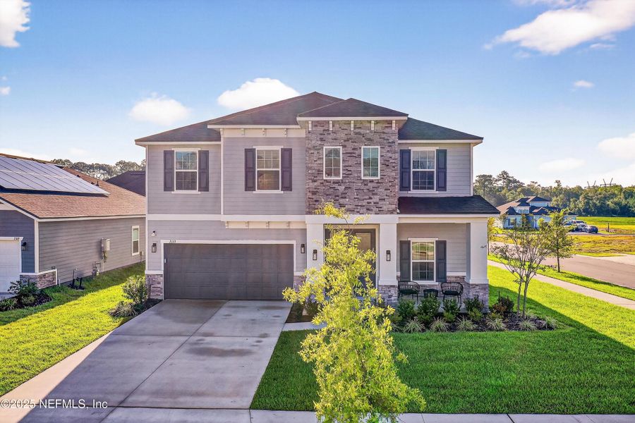 Front exterior of a new home in , Middleburg, FL, highlighting curb appeal (Image 24).
