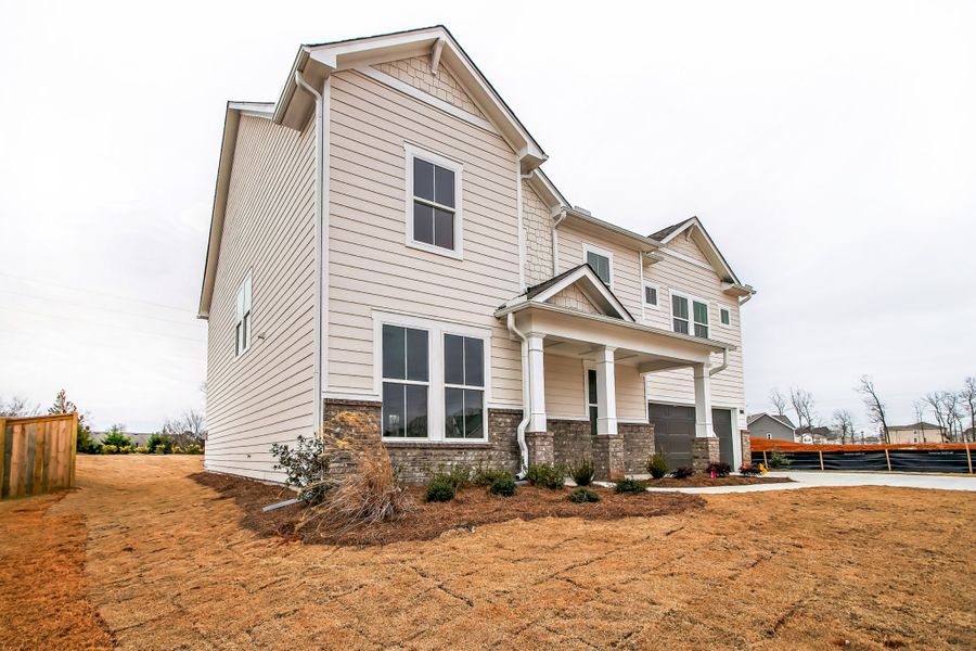 Representative exterior photo of a completed home built from the Warren by UnionMain Homes in Austin Springs, Bethlehem, GA (Image 18).