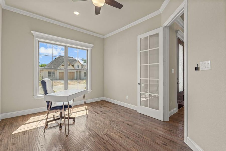 Dining area with ceiling fan, hardwood / wood-style flooring, and a healthy amount of sunlight