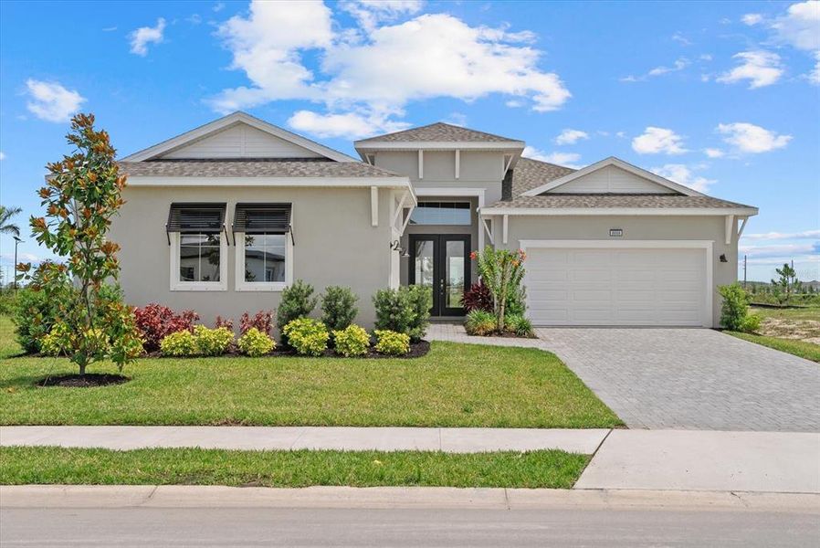 Front exterior of a new home in , Parrish, FL, highlighting curb appeal (Image 22).