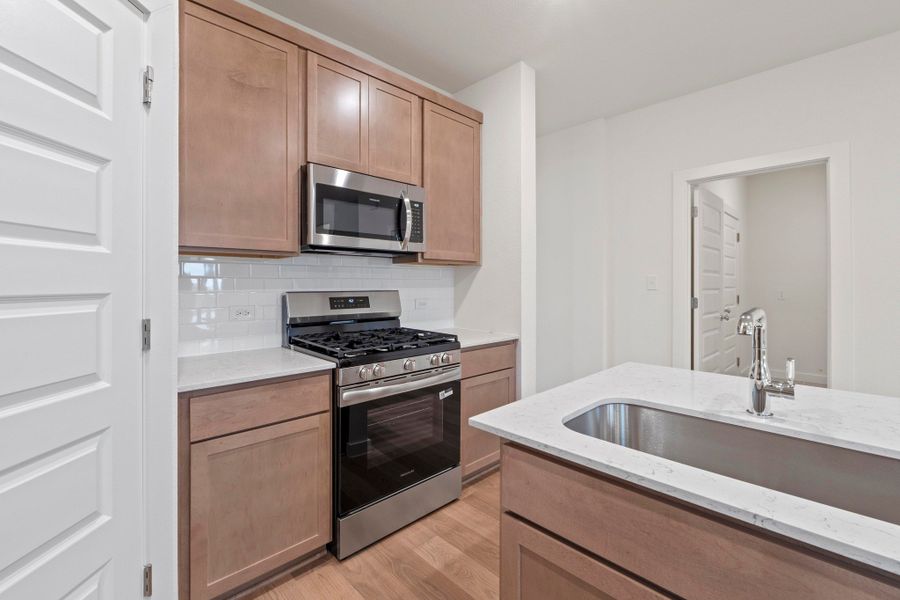 Kitchen in the Pearl home plan by Trophy Signature Homes – REPRESENTATIVE PHOTO Kitchen in the Pearl home plan by Trophy Signature Homes – REPRESENTATIVE PHOTO