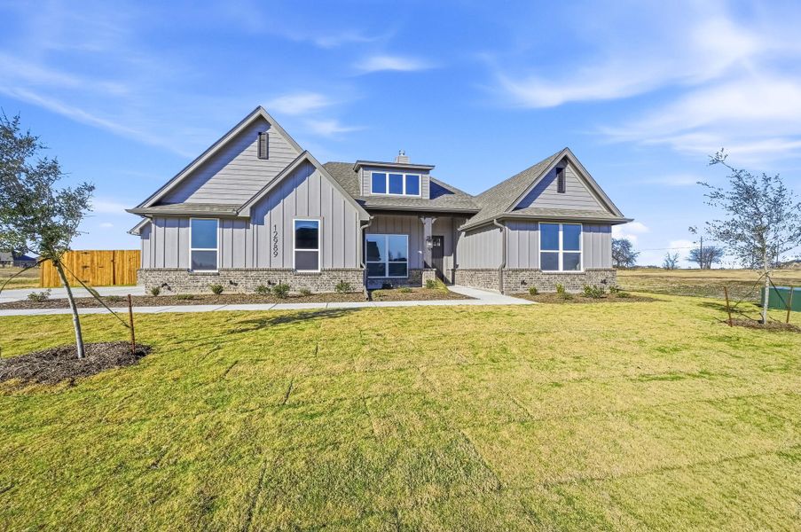 Front exterior of a new home in Coyote Crossing, Godley, TX, highlighting curb appeal (Image 27).